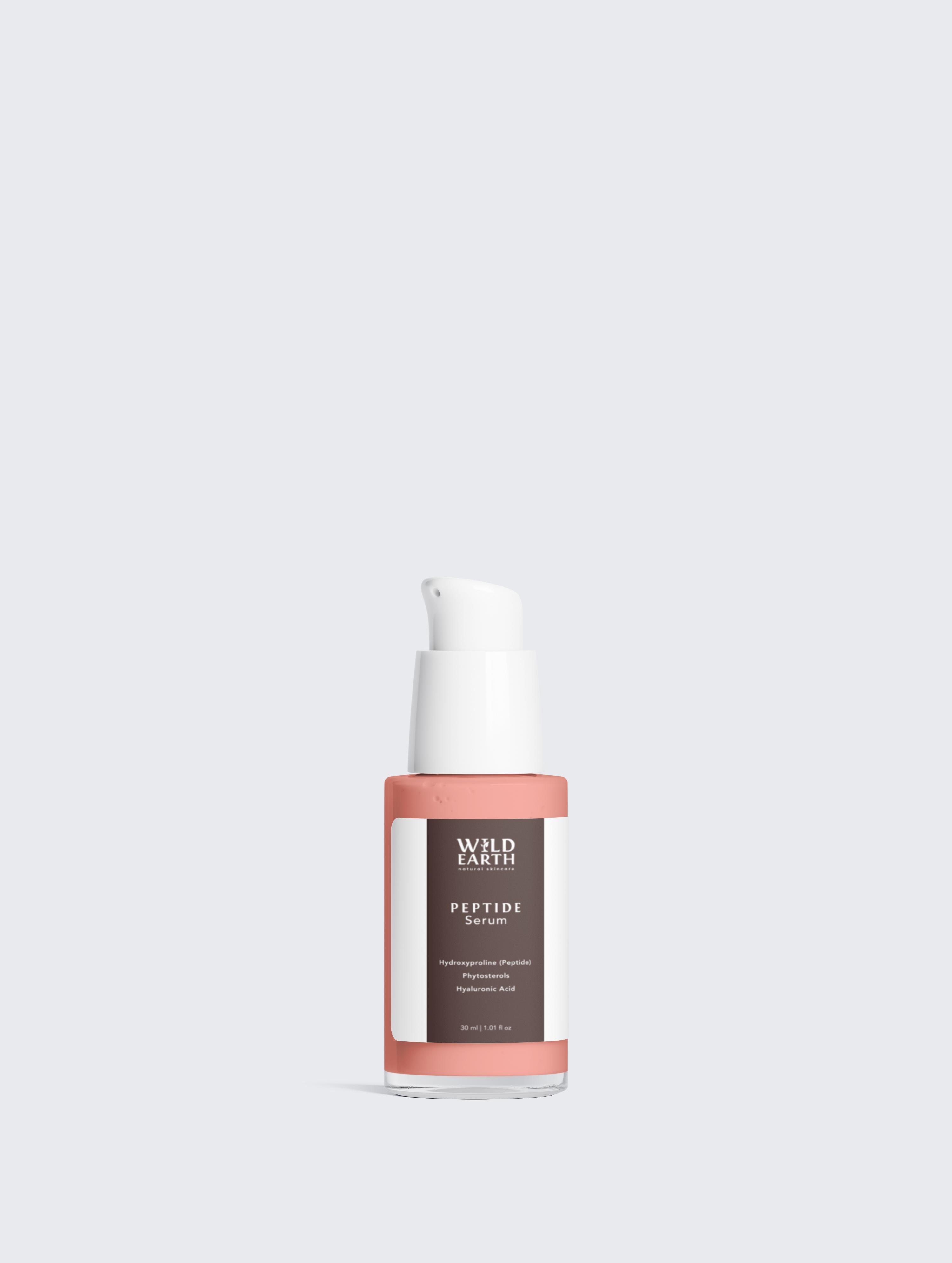 Skincare serum bottle with visible brand name on a light gray background