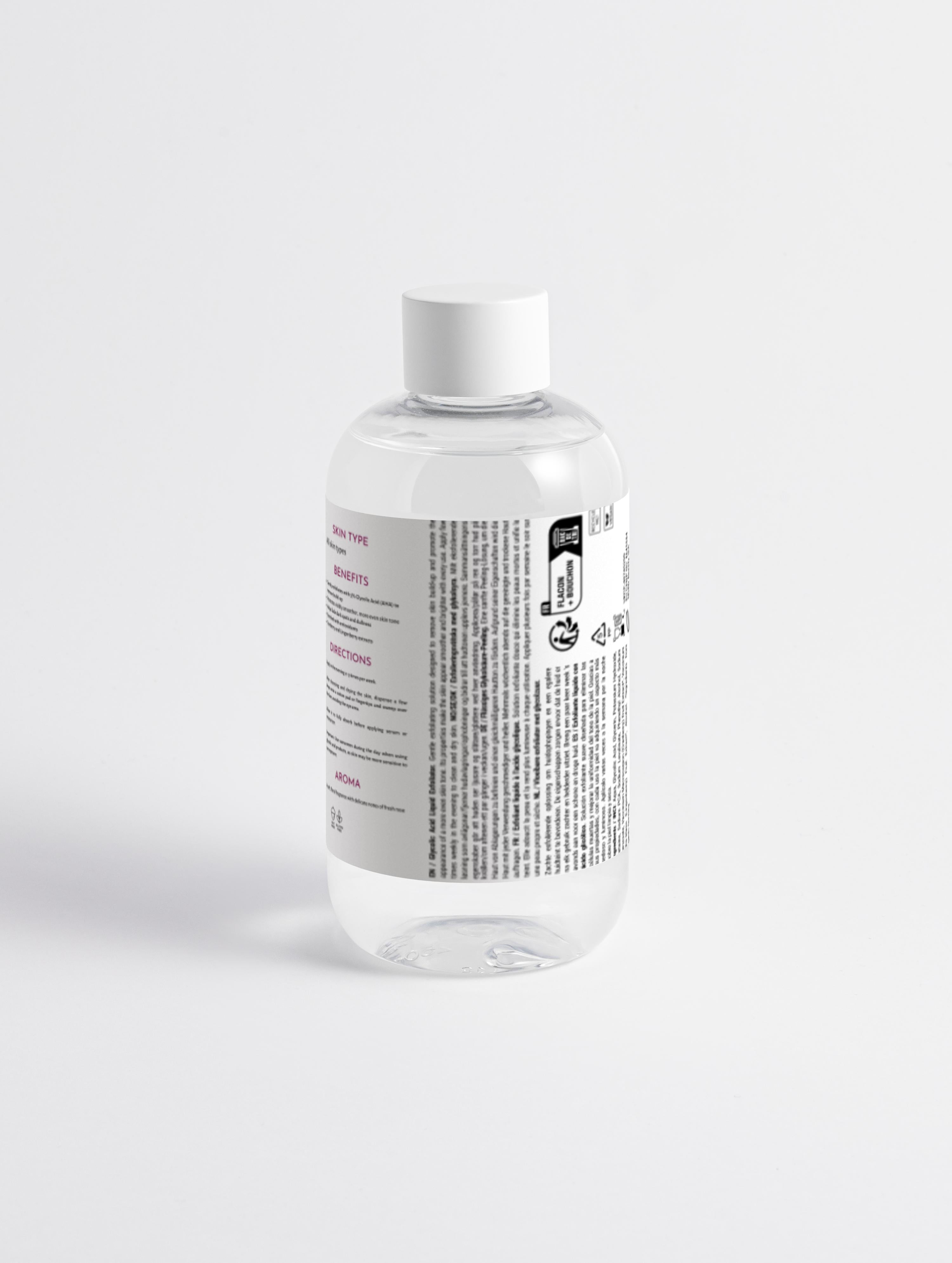 Clear bottle of Wild Earth Glycolic Acid Liquid Exfoliator with a label on a white background