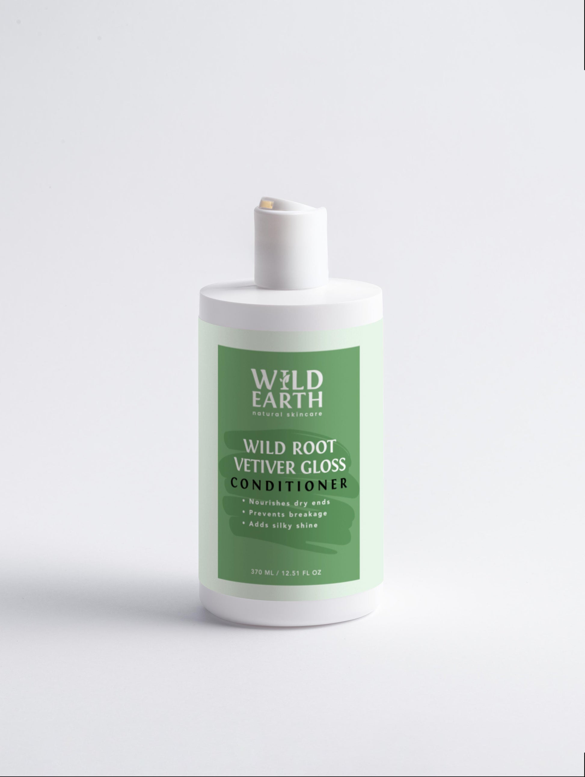 Wild Earth Wild Root Vetiver Gloss conditioner bottle on a light gray background